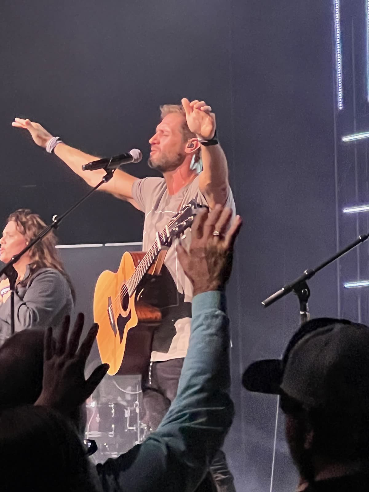 Nick leading worship with an acoustic guitar